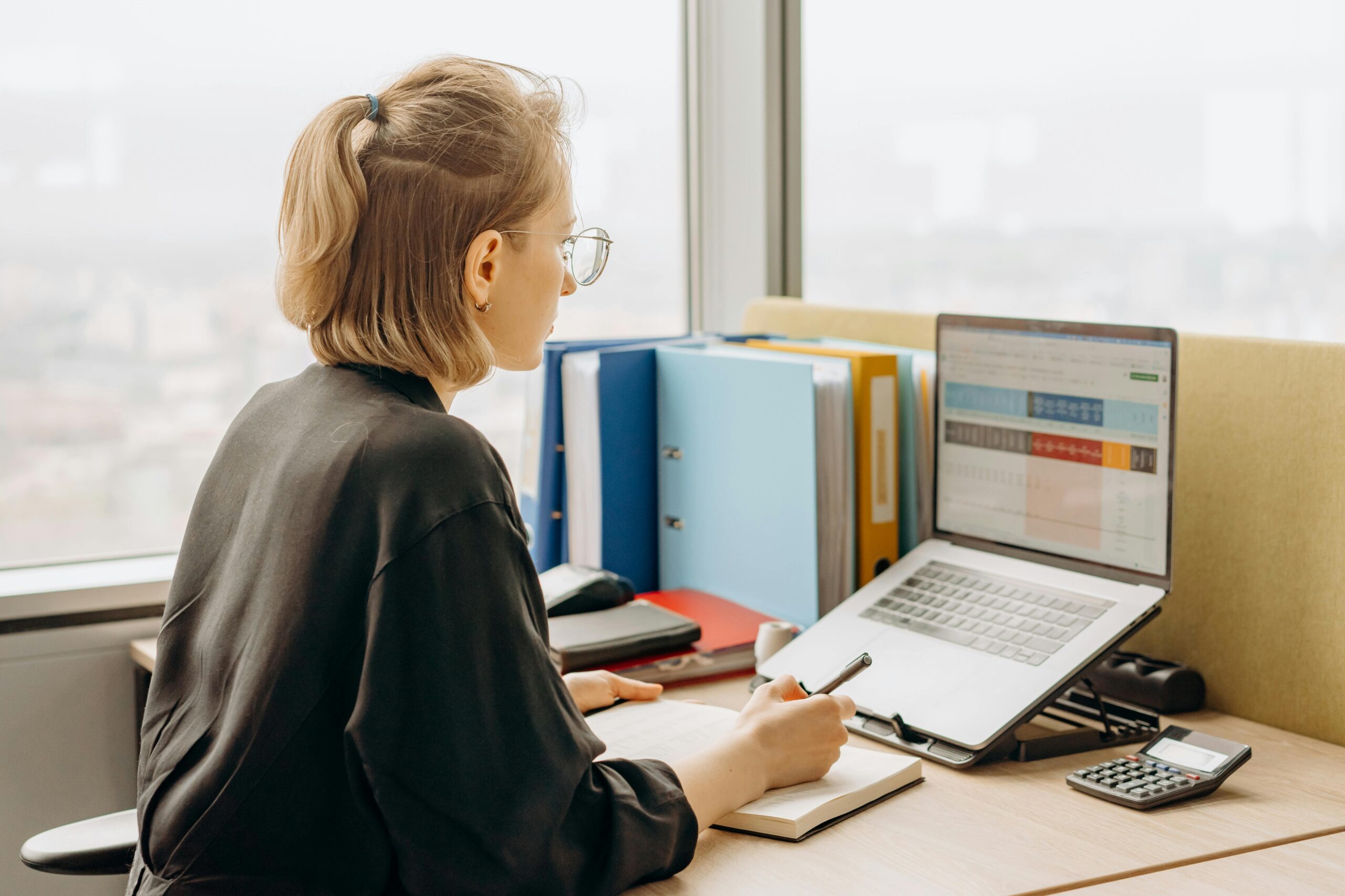 accountant updating ledger